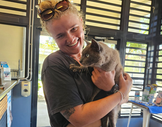 Taffy in the arms of her owner